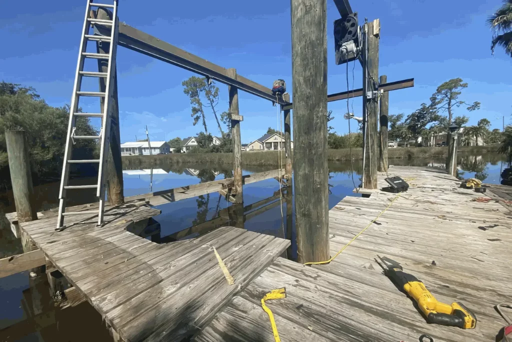 a wooden dock with ladders and a ladder on it