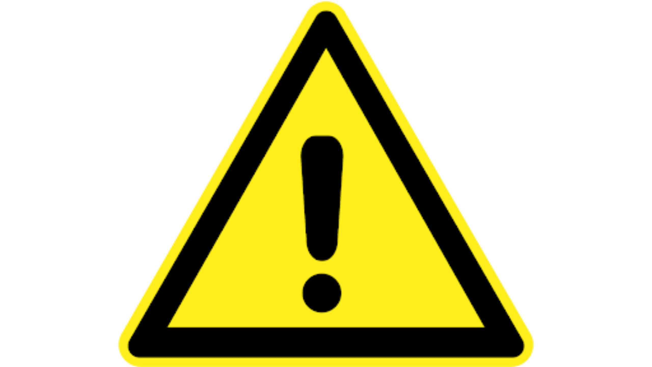A yellow triangular warning sign with a black exclamation mark, indicating caution, possibly related to seawall maintenance or hazards.