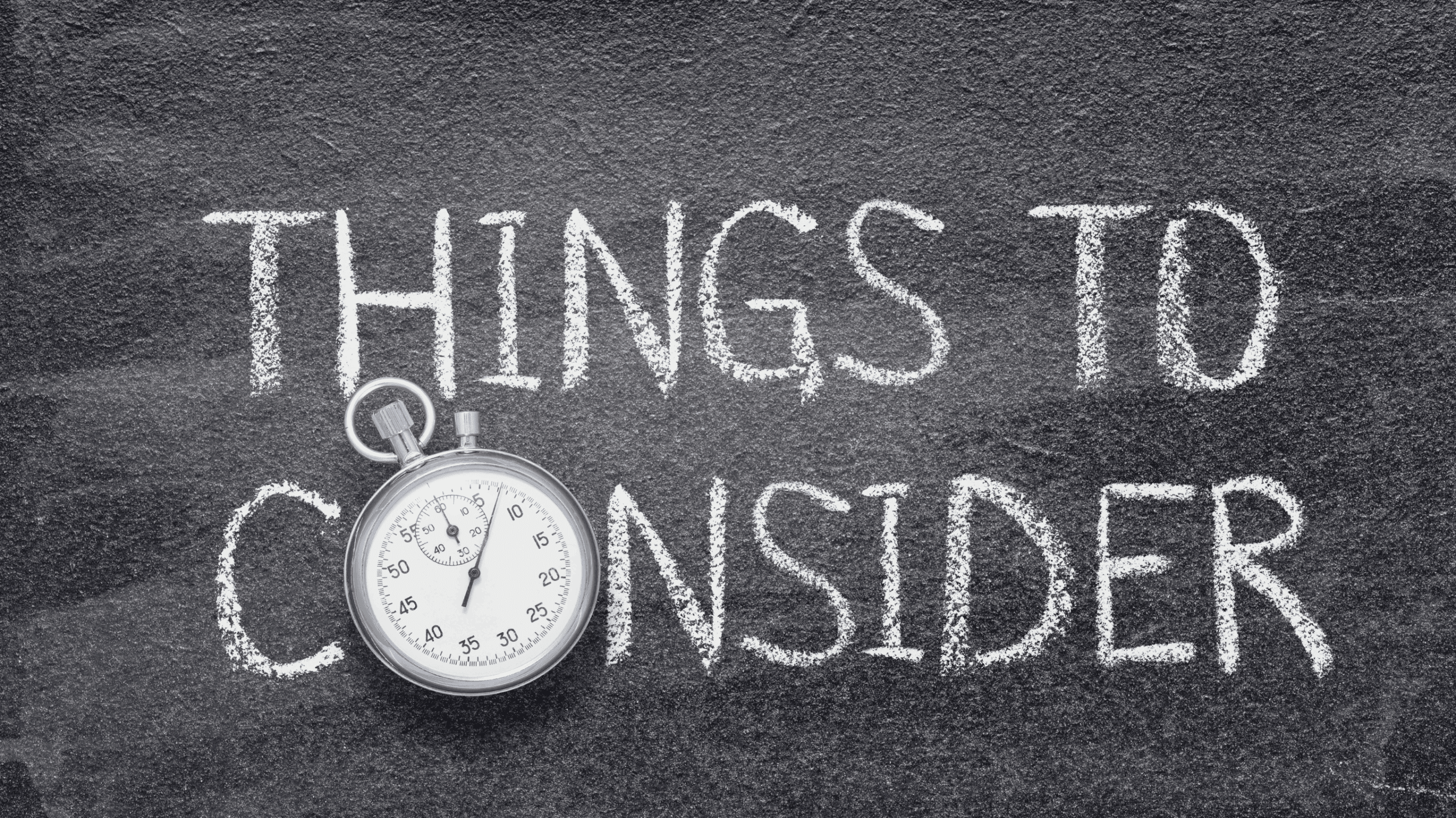 White chalk text reading THINGS TO CONSIDER on a blackboard, partially covered by a silver stopwatch resting near the bottom left.