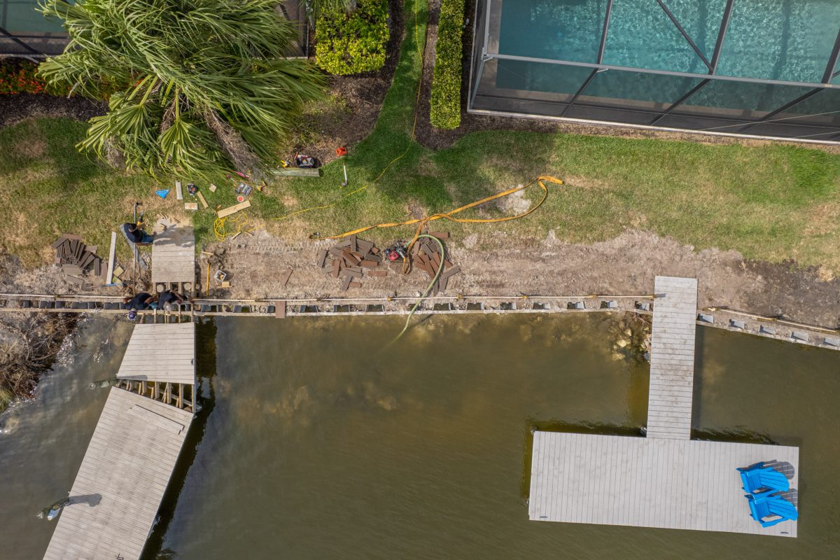 a bird's eye view of a house and a body of water