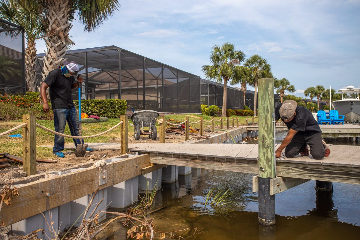 a group of men working on a dock
